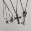 Chrome fleur cross necklace